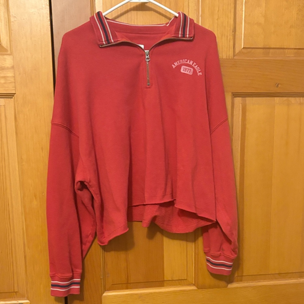 American Eagle Outfitters cropped red zip sweatshirt.